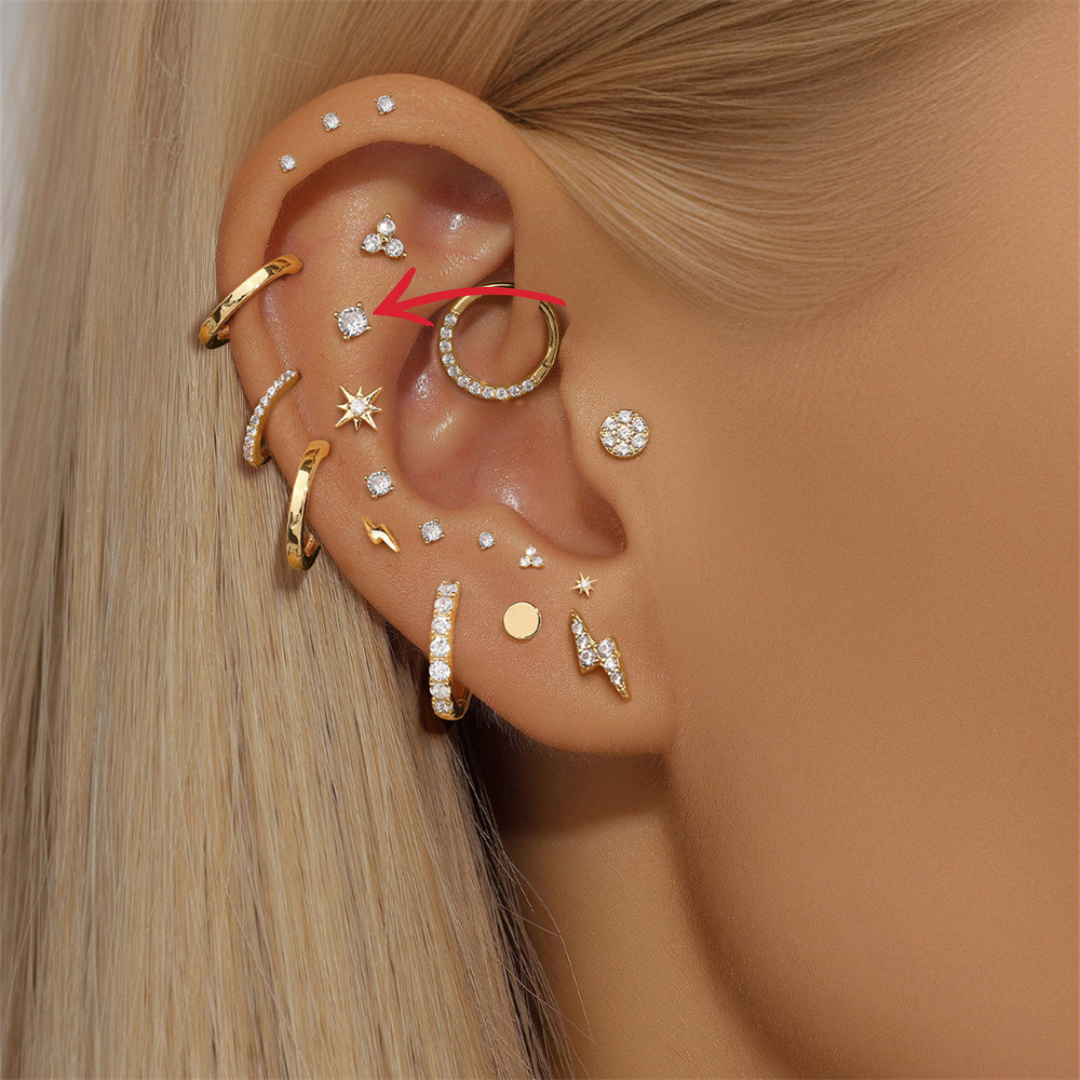 Elegant ear stack with 14K gold and zirconia stud earrings for a chic look.