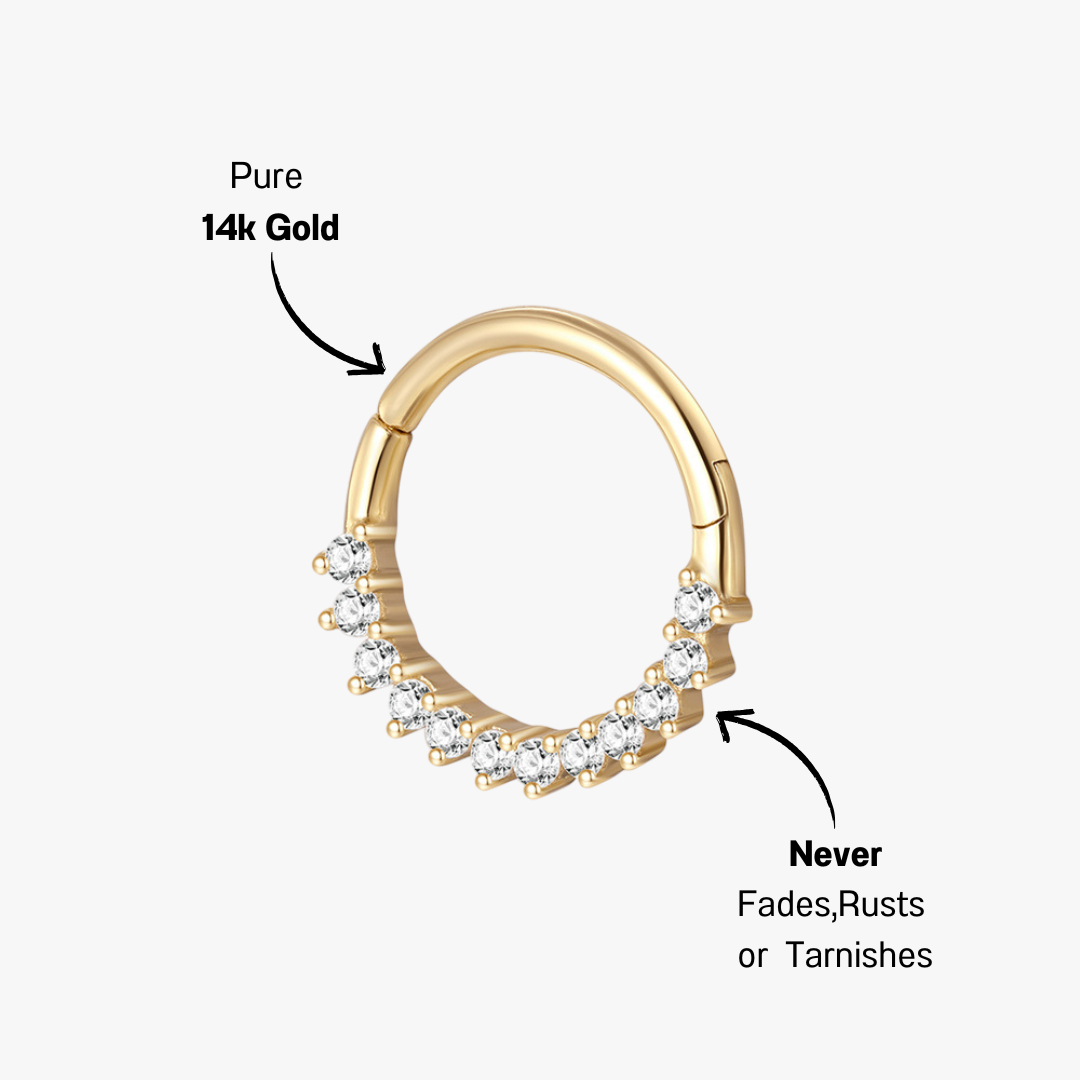 Side view of 14K gold cubic zirconia huggie earring, featuring a refined hoop design with a secure closure.