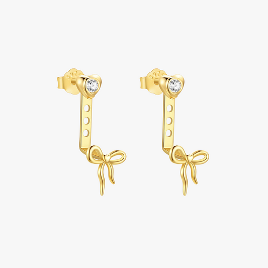 14k-gold-heart-bow-dangle-earrings-main.png – Charming 14k gold earrings with heart-shaped studs and elegant bow dangles, perfect for a sophisticated and playful look.