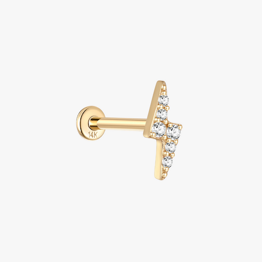 Close-up front view of a 14K gold lightning-shaped stud earring with zircon stones.