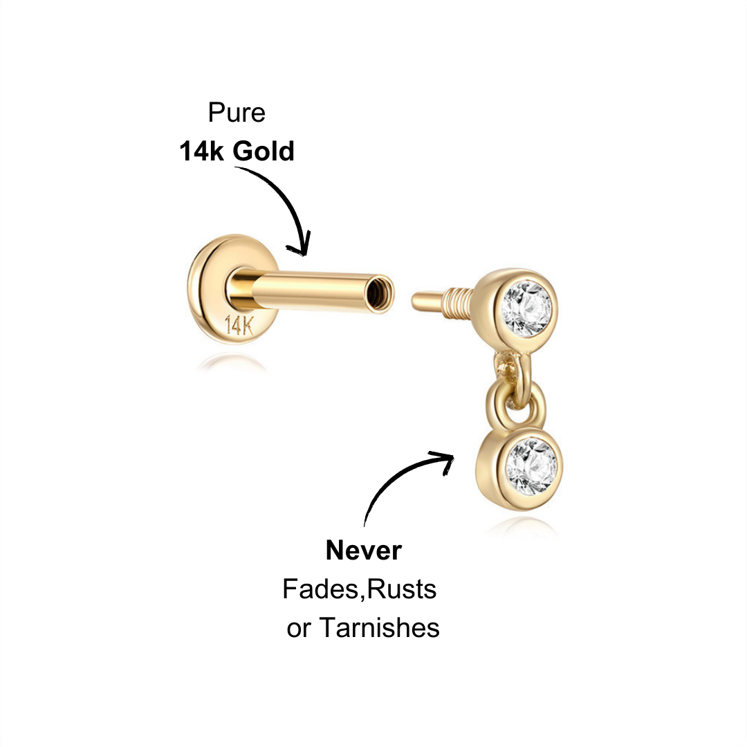 Minimalist 14K gold dangle earring featuring two sparkling zircon stones for a refined look.