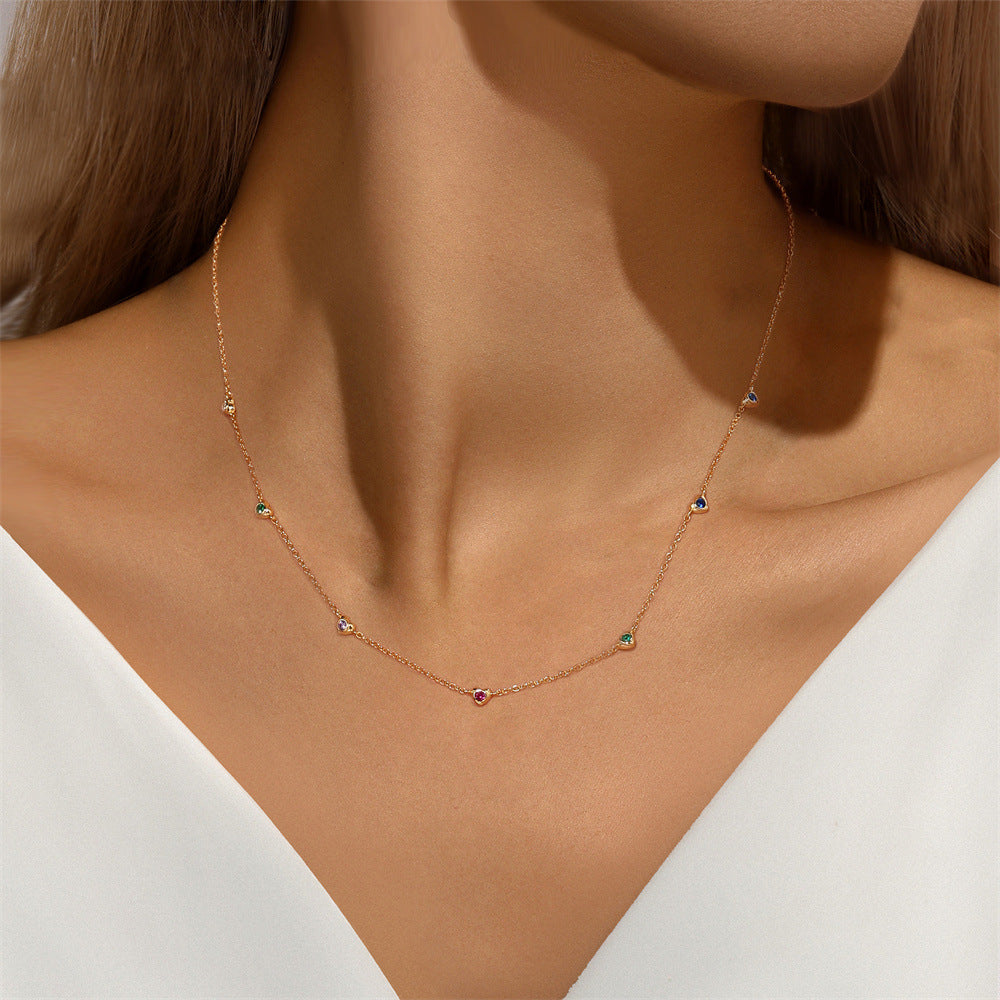 14k-gold-multicolor-gemstone-necklace-model.png – Elegant multicolor gemstone necklace in 14k gold worn by a model, showcasing its versatile design for both casual and formal occasions.