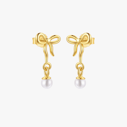 14k-gold-pearl-drop-bow-earrings-main.png – Elegant 14k gold earrings featuring bow designs with delicate pearl drops, perfect for adding a feminine touch to any outfit.