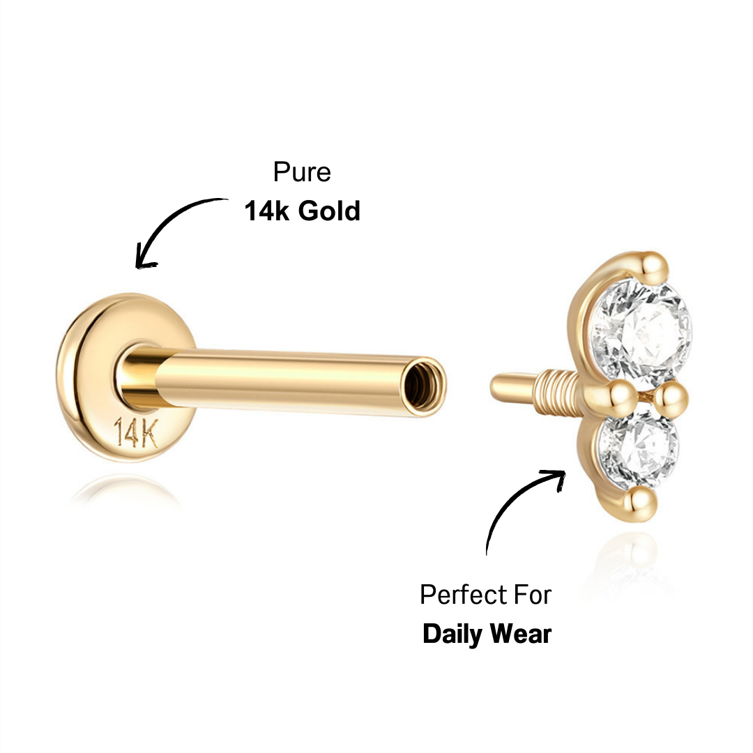 Close-up of a 14K gold triple zircon stud earring with a secure threaded back.