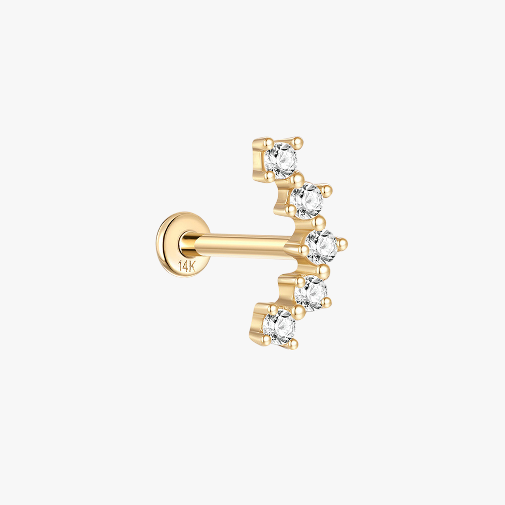 14K gold zircon cartilage earring featuring a curved design with multiple sparkling stones.