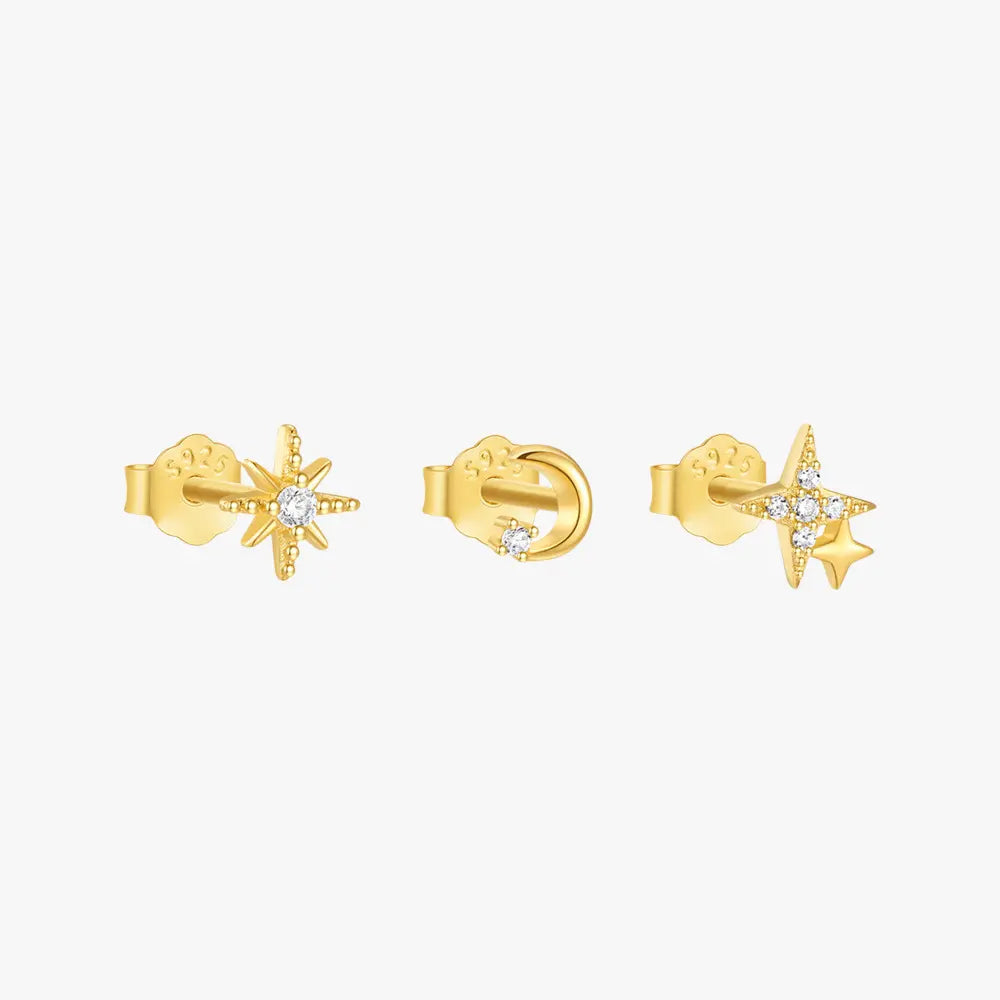 Gold stud earrings set featuring a star-shaped earring with a crystal center, a shooting star design, and a crescent moon earring with a crystal accent.