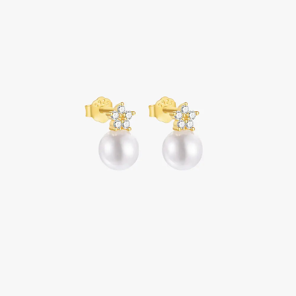 925 sterling silver 14k gold-plated flower and pearl drop earrings with sparkling zirconia accents.