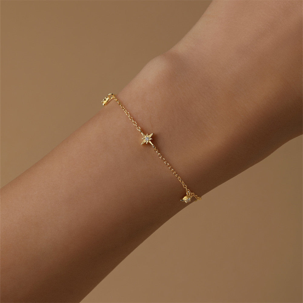 Model wearing a 925 sterling silver eight-pointed star zircon bracelet with a sparkling design, perfect for everyday elegance.