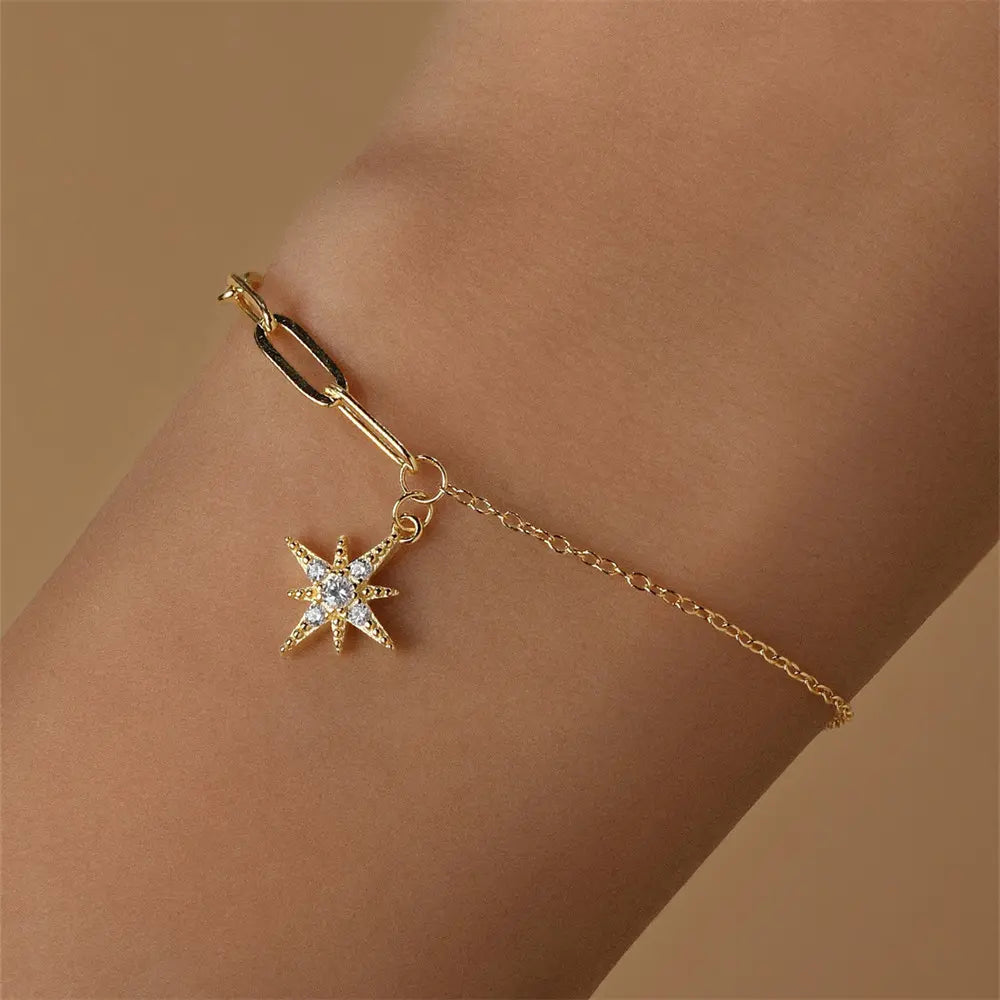 925 sterling silver eight-point star zirconia bracelet worn on wrist.