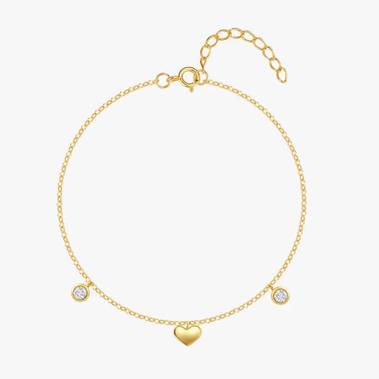 925 sterling silver heart bracelet with zirconia on gold chain, front view on white background.