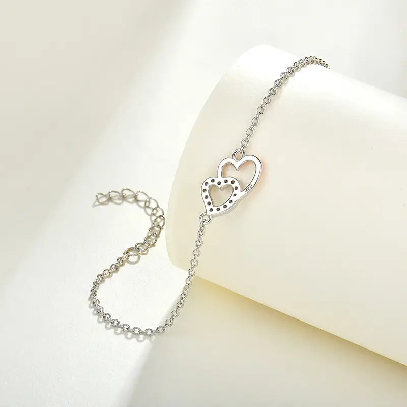 Pulsera de plata de ley con corazón entrelazado