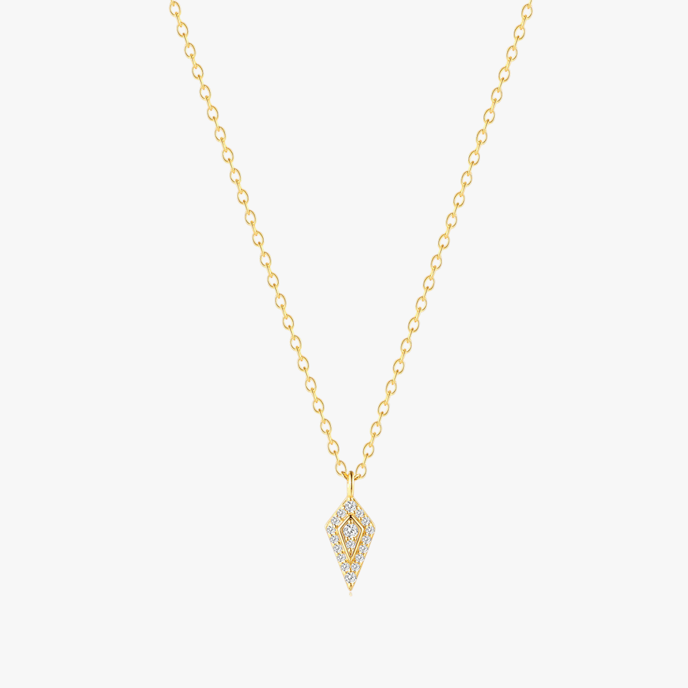 Sparkling diamond-shaped zircon pendant on a gold chain, perfect for elegant occasions.