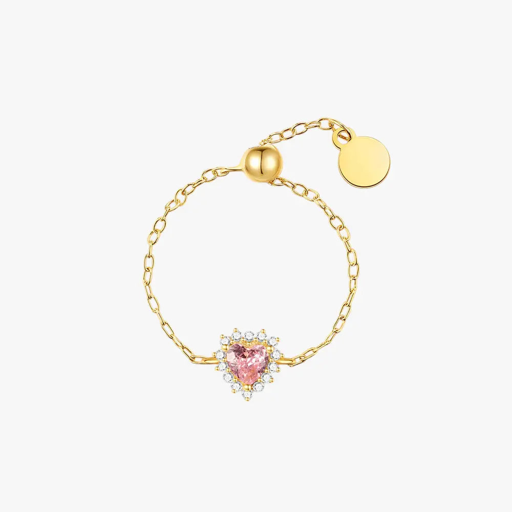 Gold-plated 925 sterling silver ring with a heart-shaped pink zirconia center, surrounded by smaller clear zirconia stones.