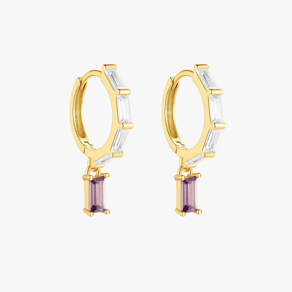 Elegant drop earrings featuring sparkling zirconia stones set in 925 sterling silver with gold plating. Perfect for any occasion.