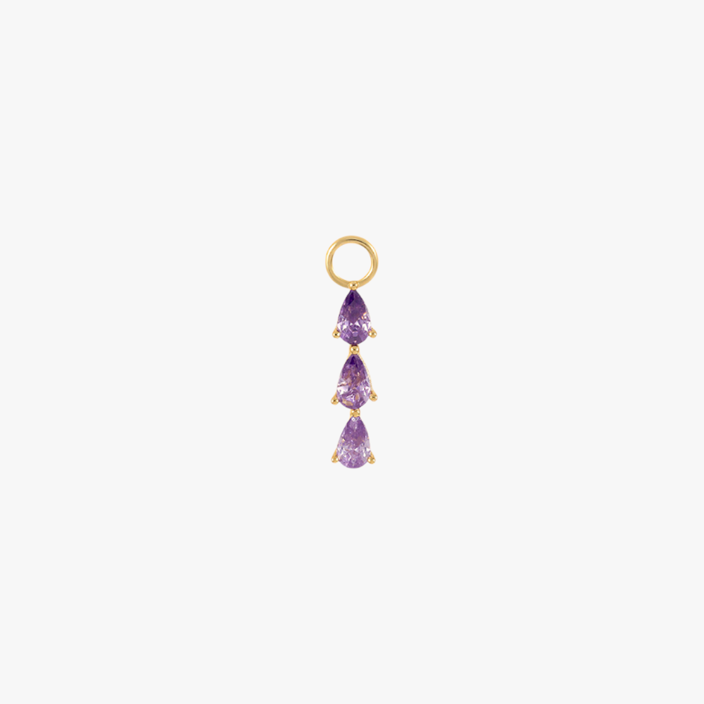 A gold charm with amethysts.