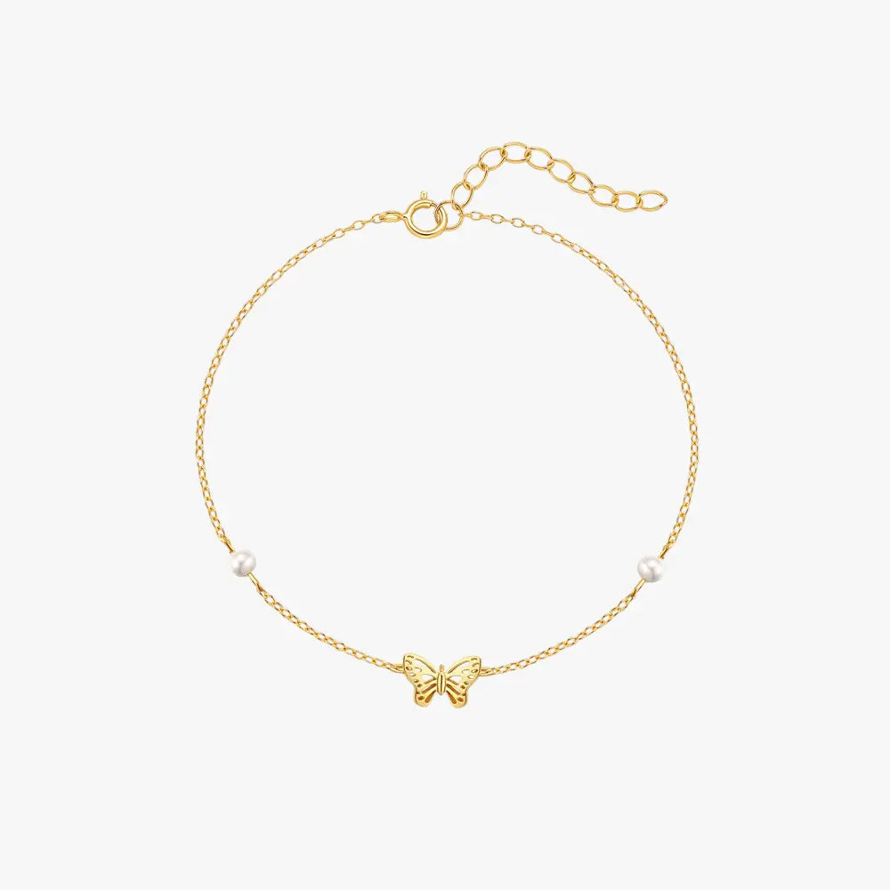 Gold 925 sterling silver butterfly bracelet with pearl accents on a white background.