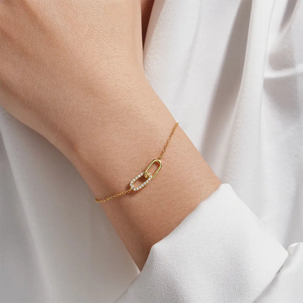 Model showcasing the elegant gold crossover zirconia bracelet