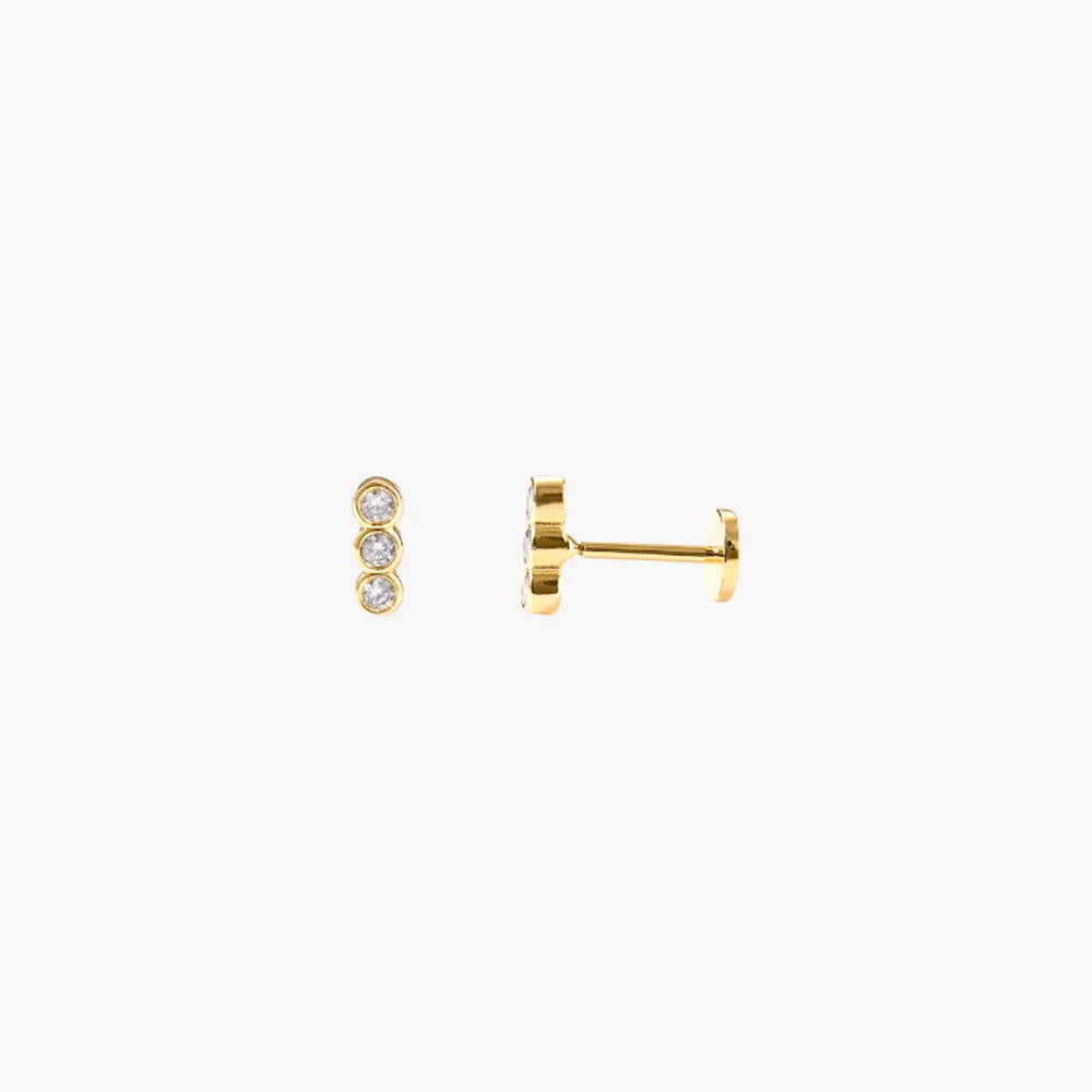  A pair of gold stud earrings with a diamond bar.