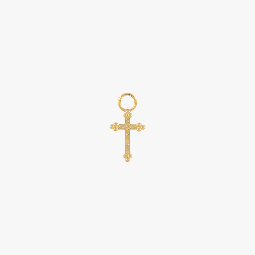 A gold cross charm with diamonds.