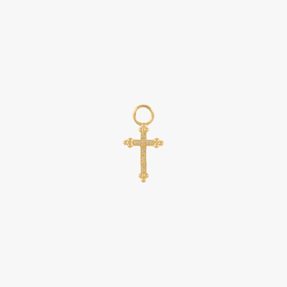 A gold cross charm with diamonds.