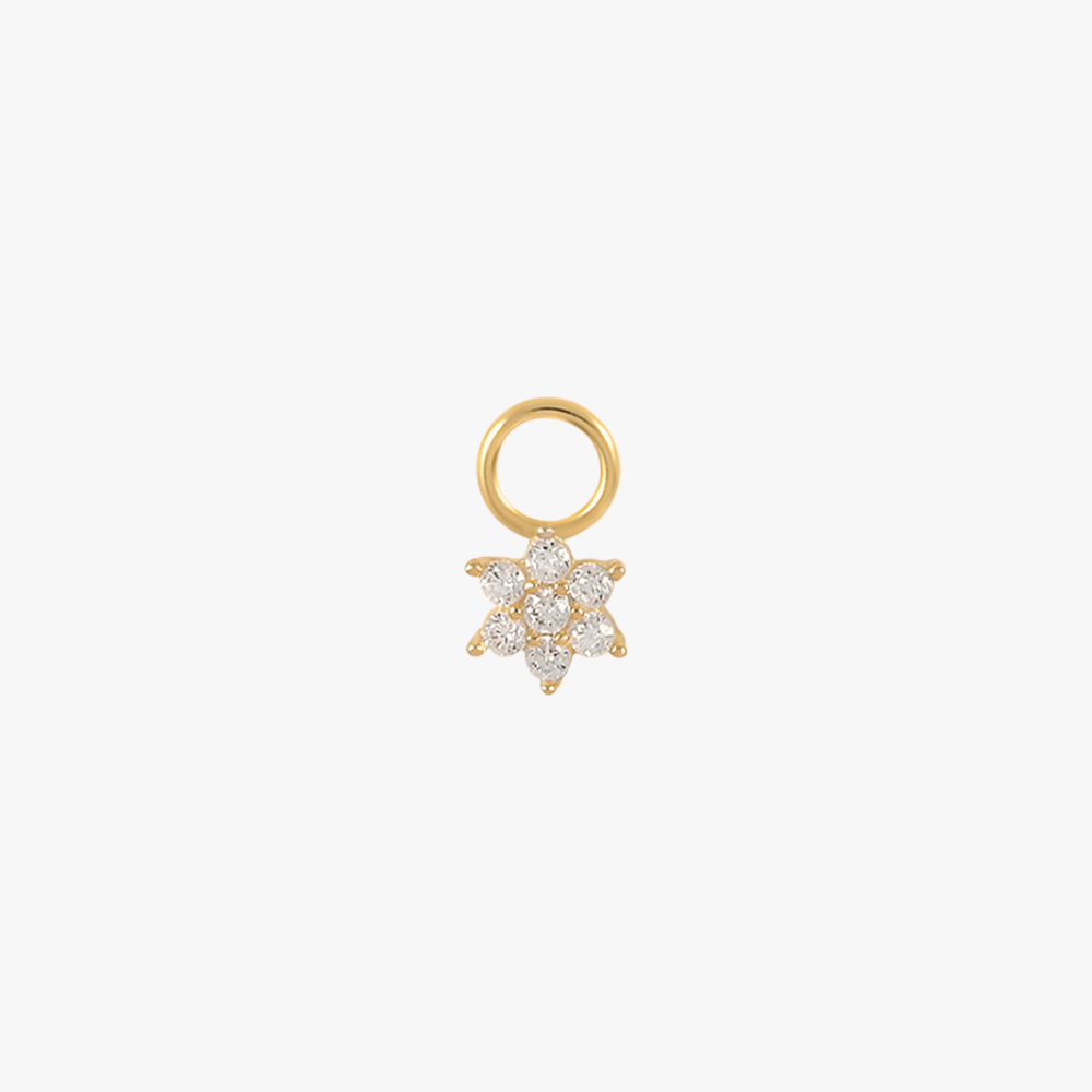 A gold flower charm with diamonds.