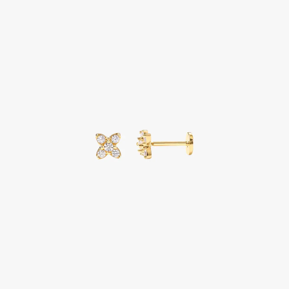 A pair of gold stud earrings with a flower design set with diamonds.