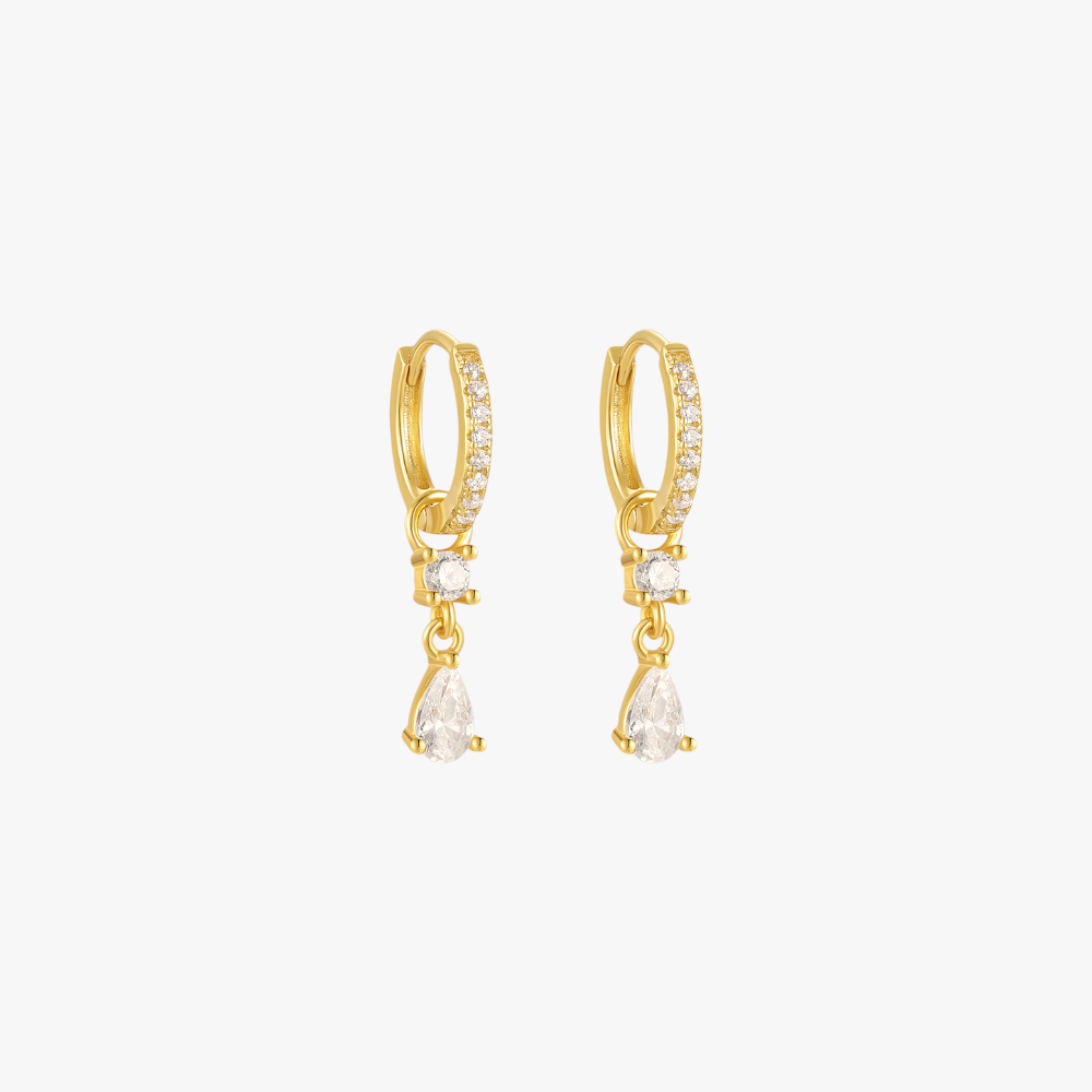 A pair of gold hoop earrings with teardrop charms, set with diamonds.