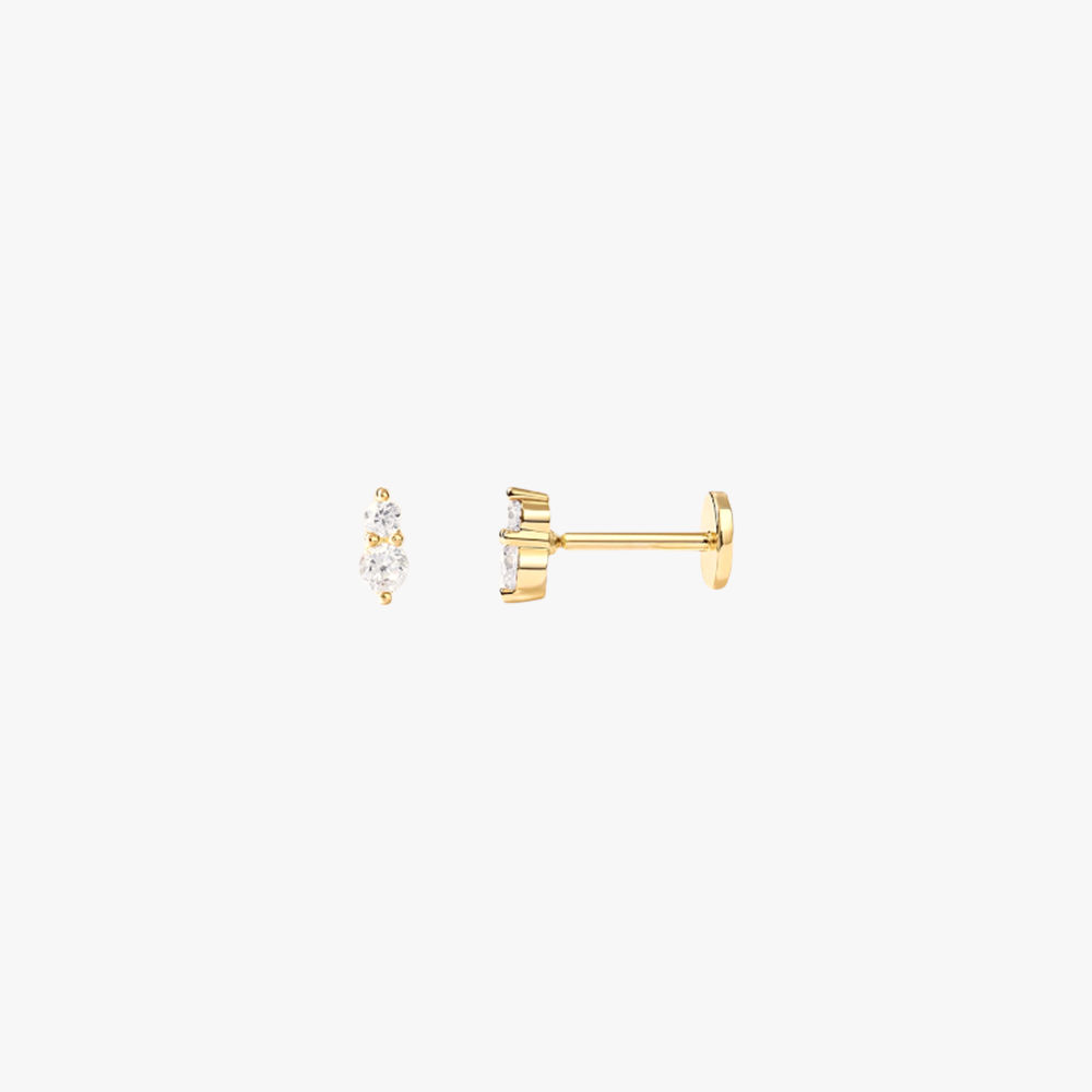  A pair of gold stud earrings with diamonds.