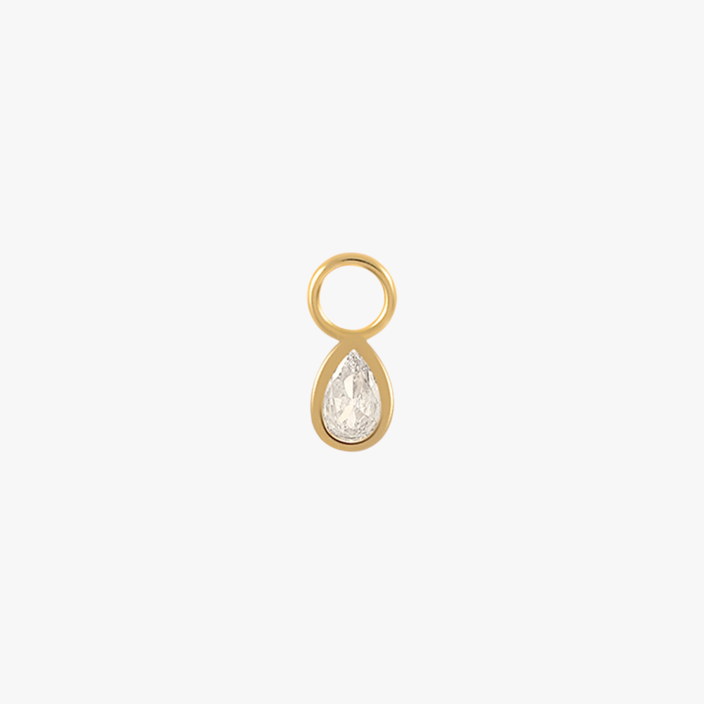 A gold teardrop charm with a diamond.