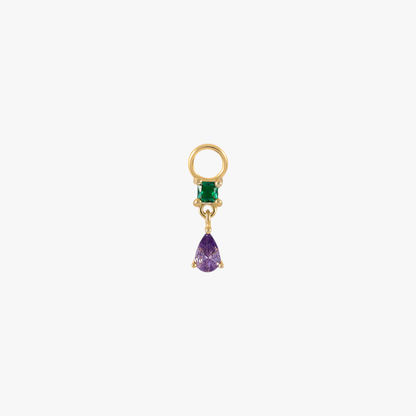 A gold charm with an emerald and amethyst.