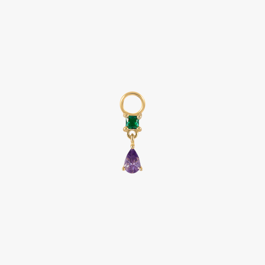 A gold charm with an emerald and amethyst.