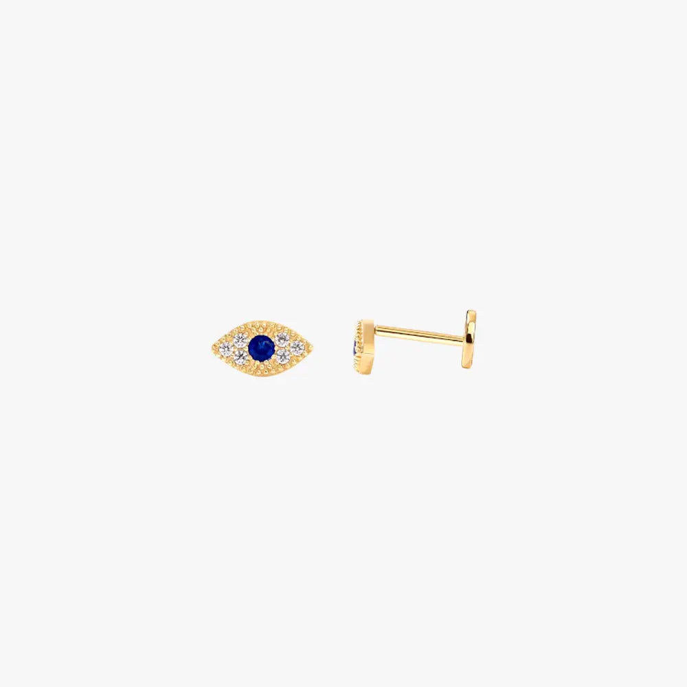 A pair of gold stud earrings with an evil eye design.