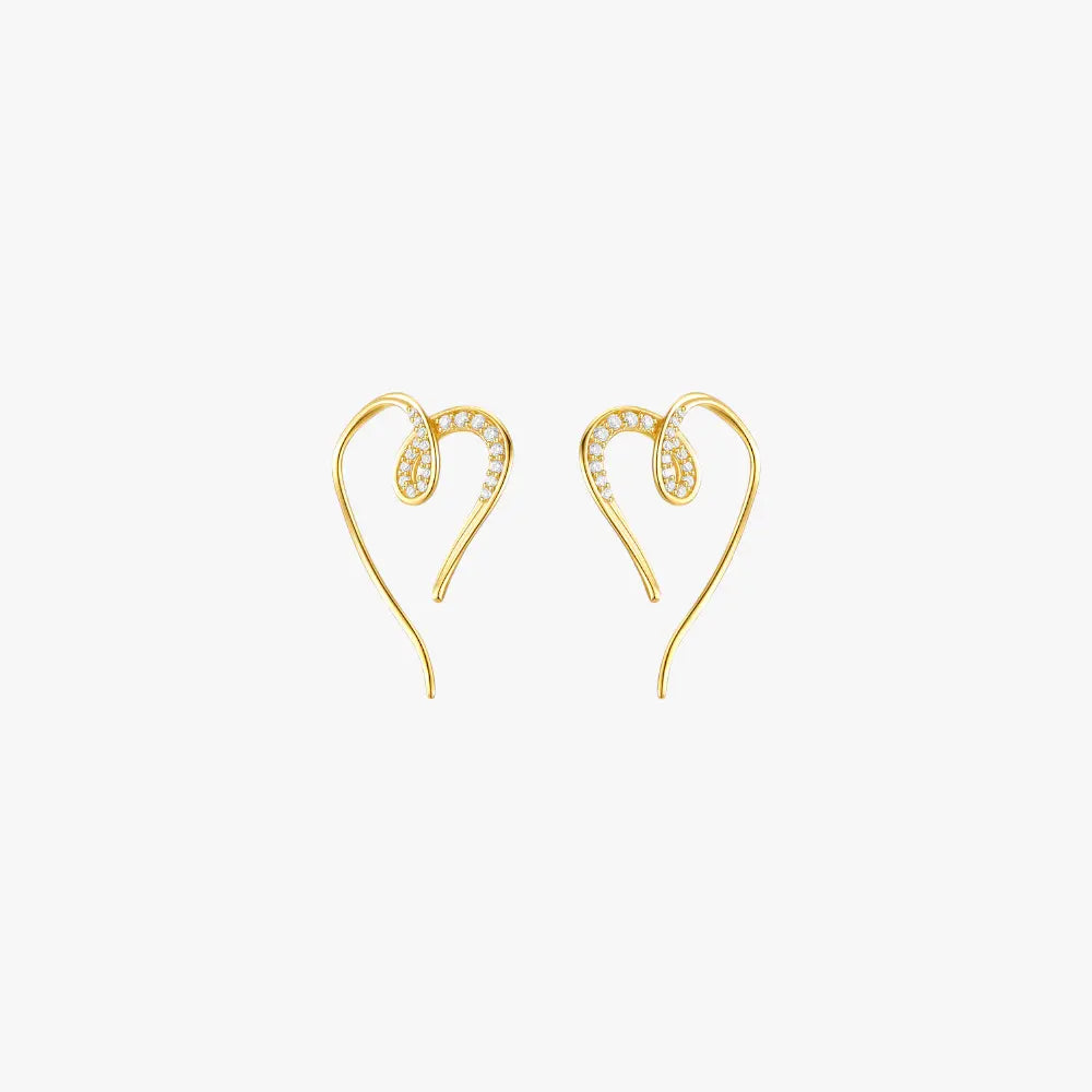 A pair of gold heart hoop earrings.