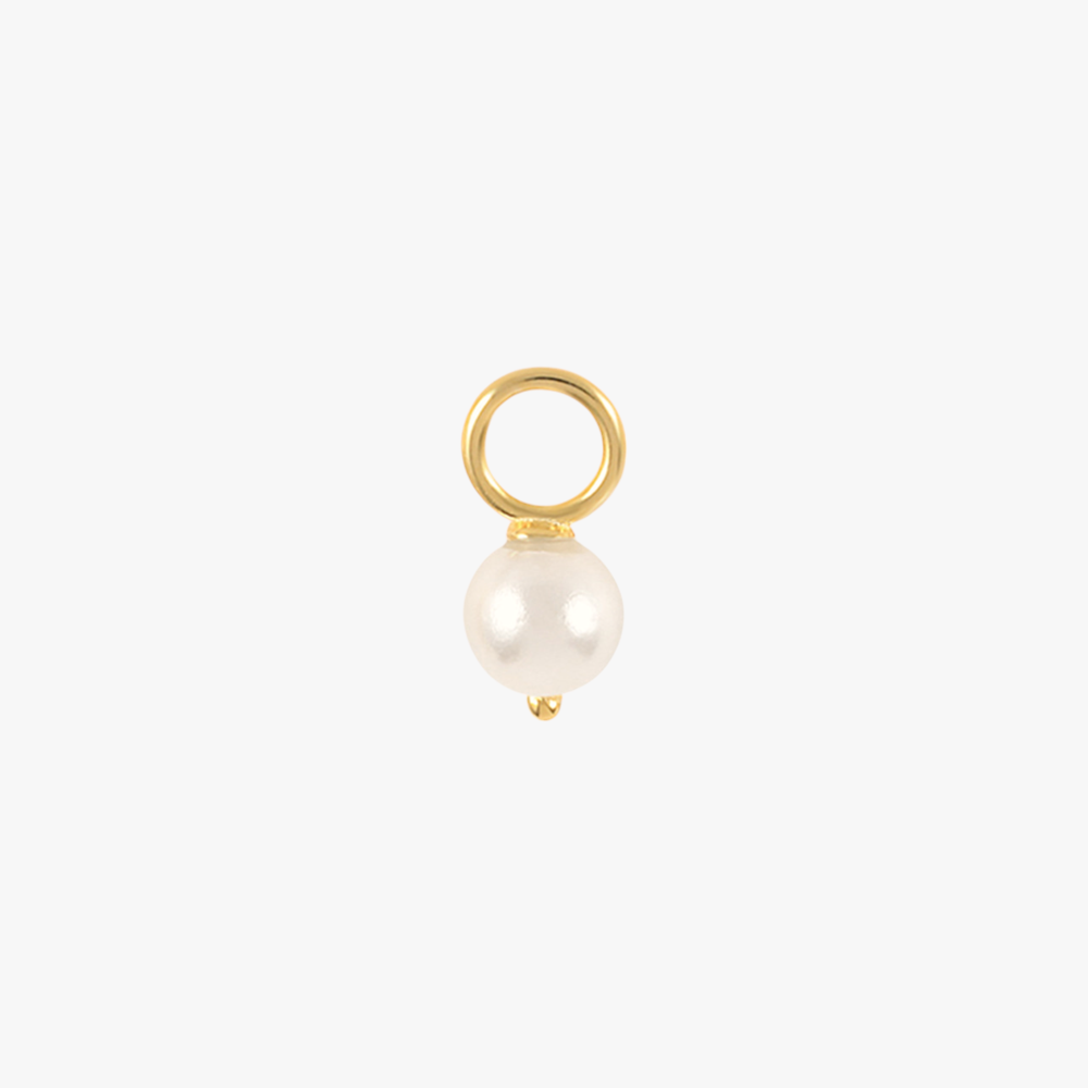 A gold charm with a pearl.