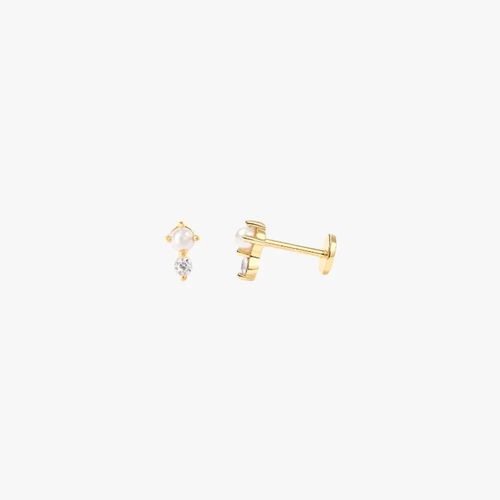 A pair of gold stud earrings with pearls and diamonds.