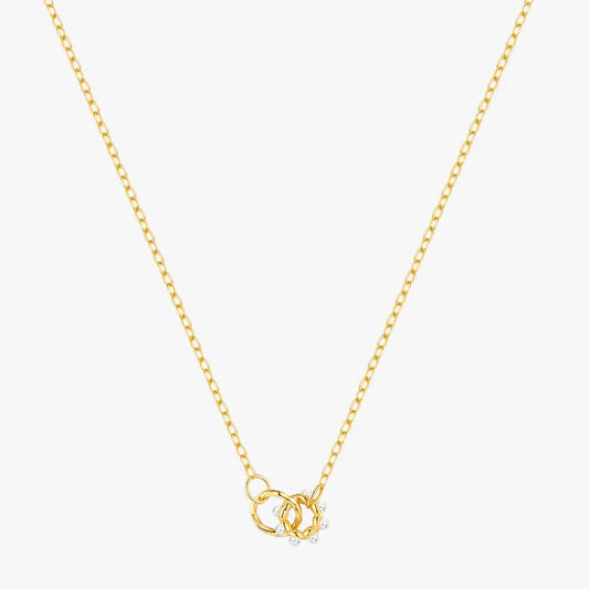 Elegant gold necklace featuring a delicate double-circle pendant adorned with pearl accents, crafted in 925 sterling silver, perfect for everyday wear or gifting.