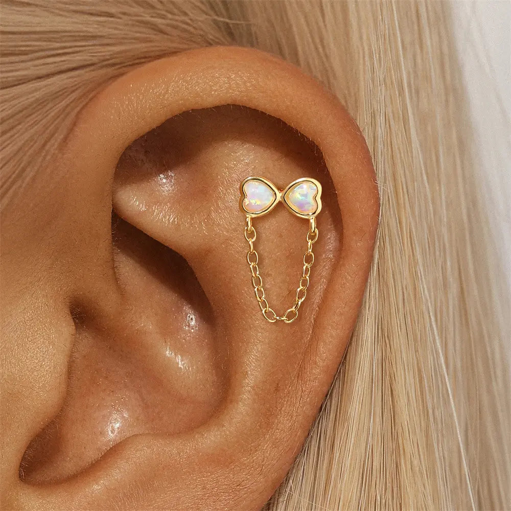 Model Wearing 925 Sterling Silver 14K Gold Plated Opal Heart Earrings with Chain Detail