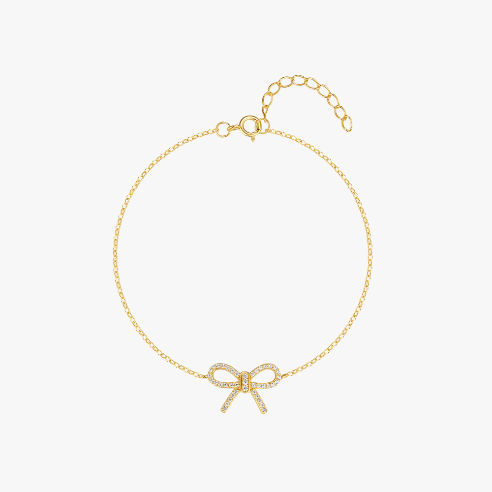 Gold bracelet with a delicate bow pendant adorned with sparkling cubic zirconia stones, crafted from high-quality 925 sterling silver.