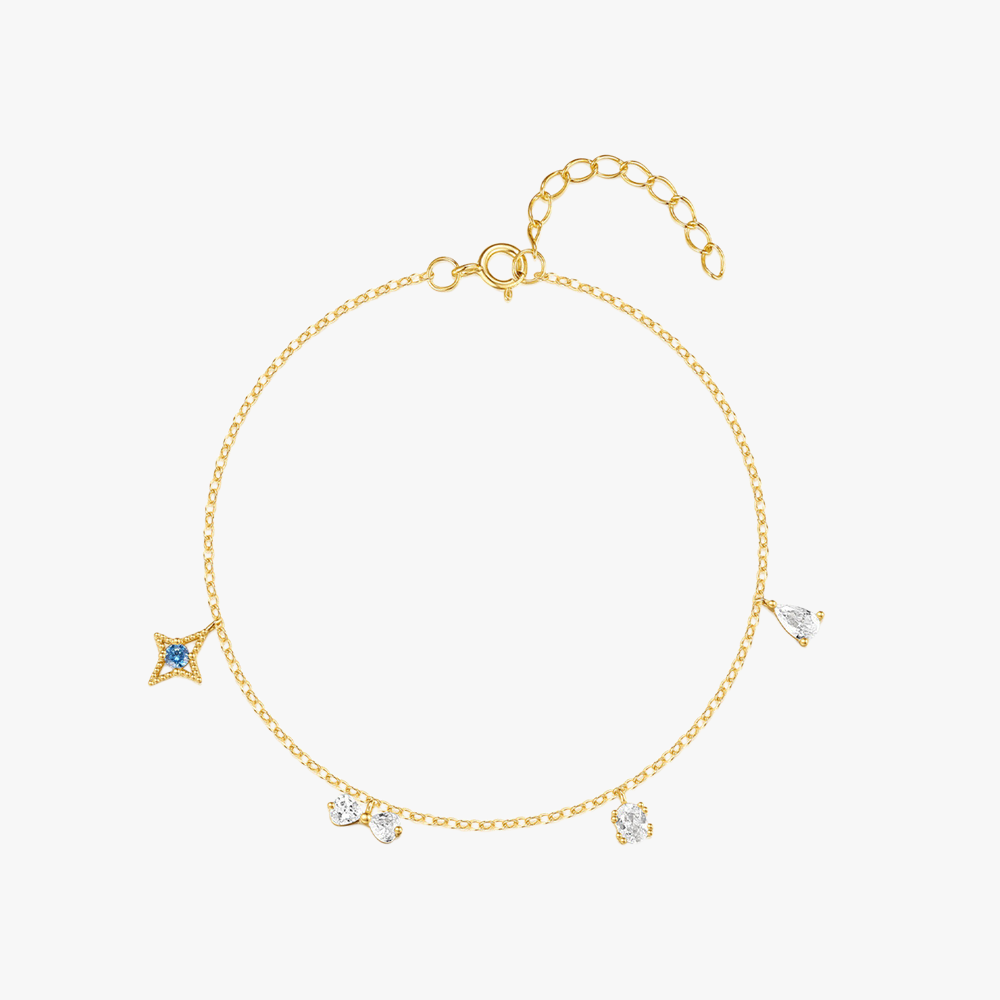 Gold-plated sterling silver bracelet with star and crystal charm details, featuring delicate craftsmanship.