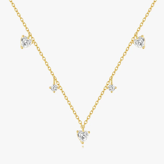 Gold-plated necklace with delicate heart-shaped pendants and sparkling cubic zirconia accents, made with high-quality 925 sterling silver.