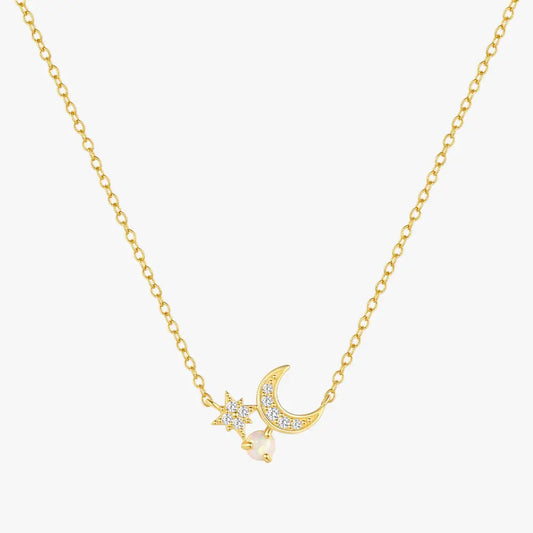 Gold necklace with crescent moon, star, and pearl charms, made from 925 sterling silver with gold plating.