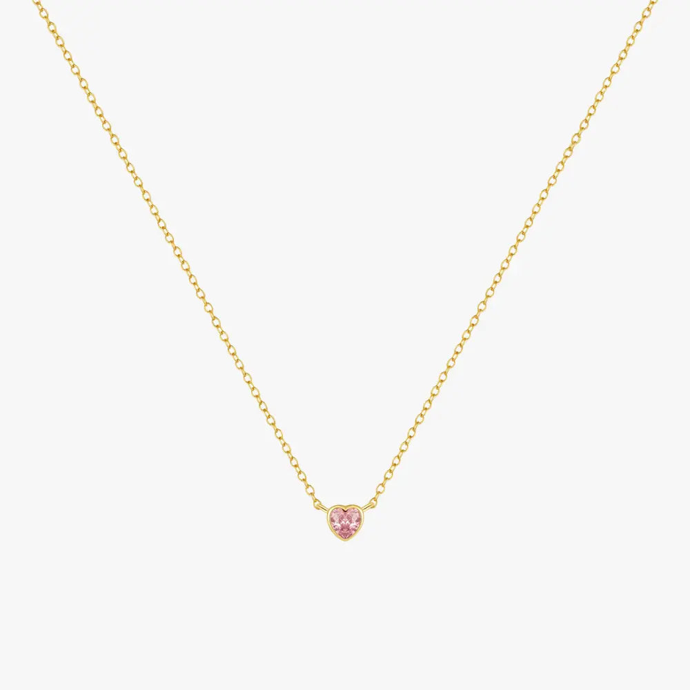 Elegant heart-shaped pink gemstone necklace, made from high-quality 925 sterling silver with a radiant gold finish, displayed on a white background.