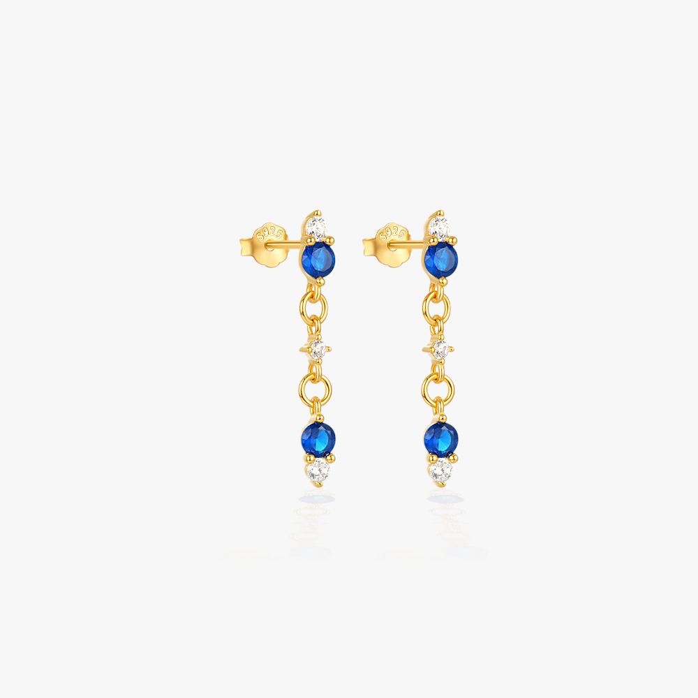 Stylish S925 sterling silver earrings with blue crystals and gold-plated chain drops.