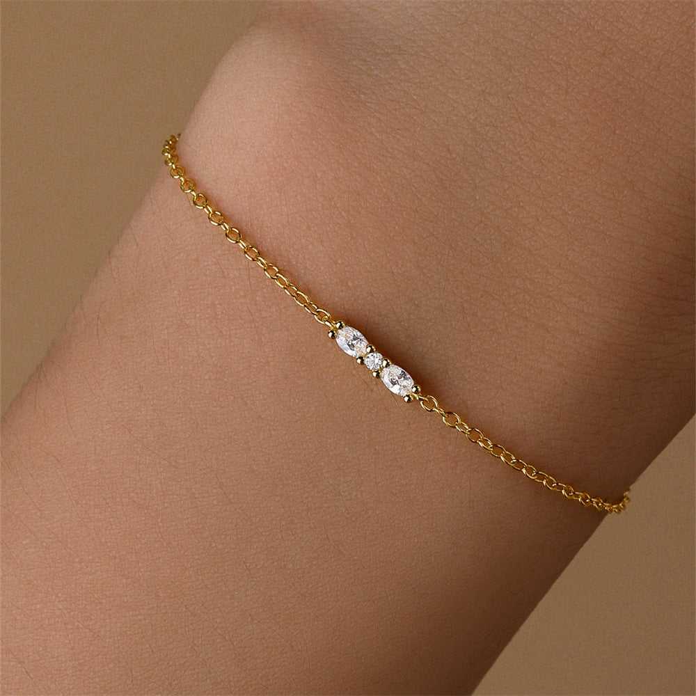 Close-up of the S925 sterling silver bracelet with three sparkling zirconia stones.