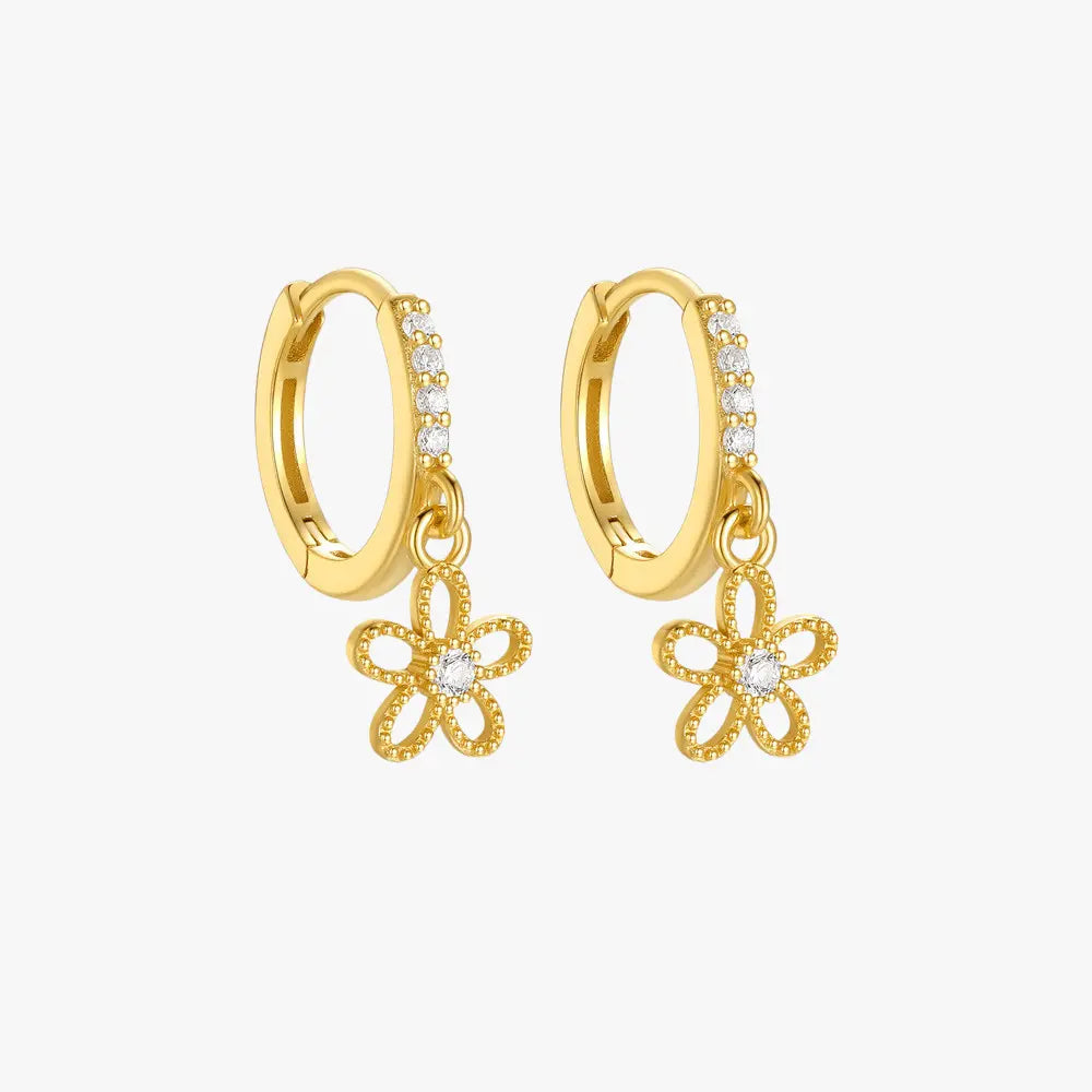 Gold flower charm hoop earrings adorned with sparkling cubic zirconia, perfect for elegant and modern styles.