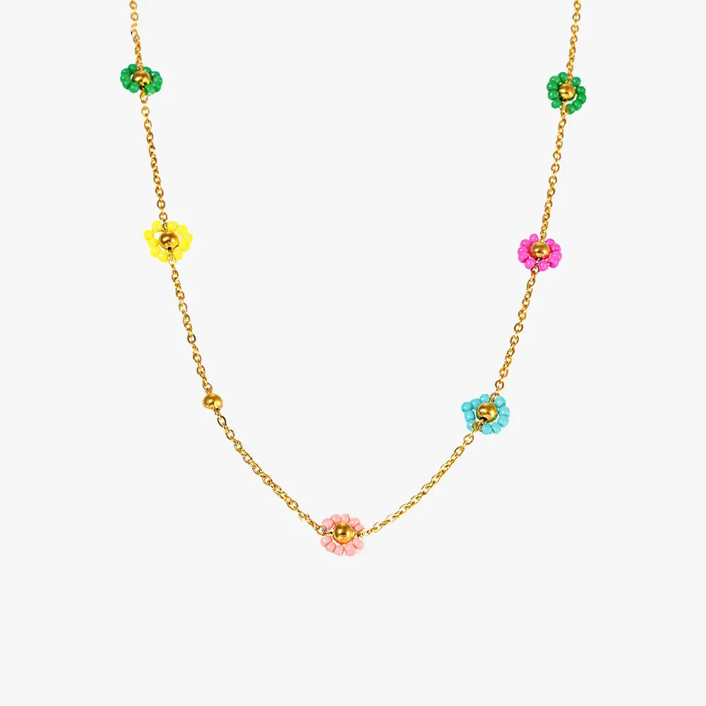 Colorful flower design necklace with Japanese imported glass beads on a gold chain.