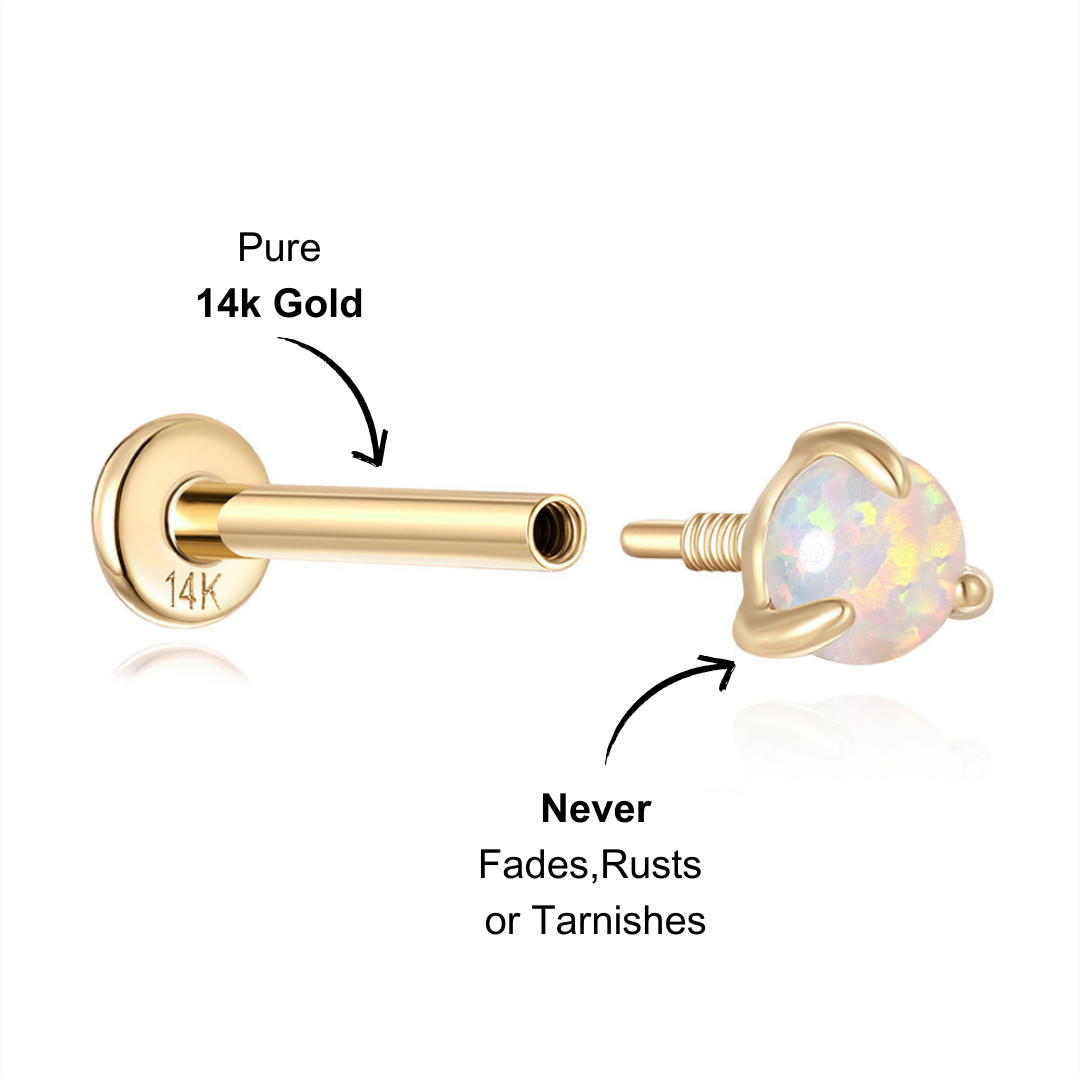 Dainty 14K gold opal stud earring with iridescent glow.