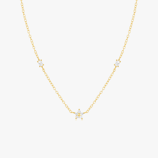 Delicate gold chain pearl necklace in minimalist style with multiple freshwater pearls.