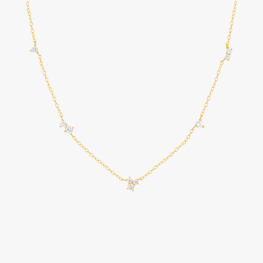 Gold necklace with delicate star-shaped charms, perfect for layering