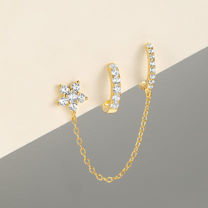 Gold flower diamond stud and huggie earrings with connecting chain, chic and sophisticated.